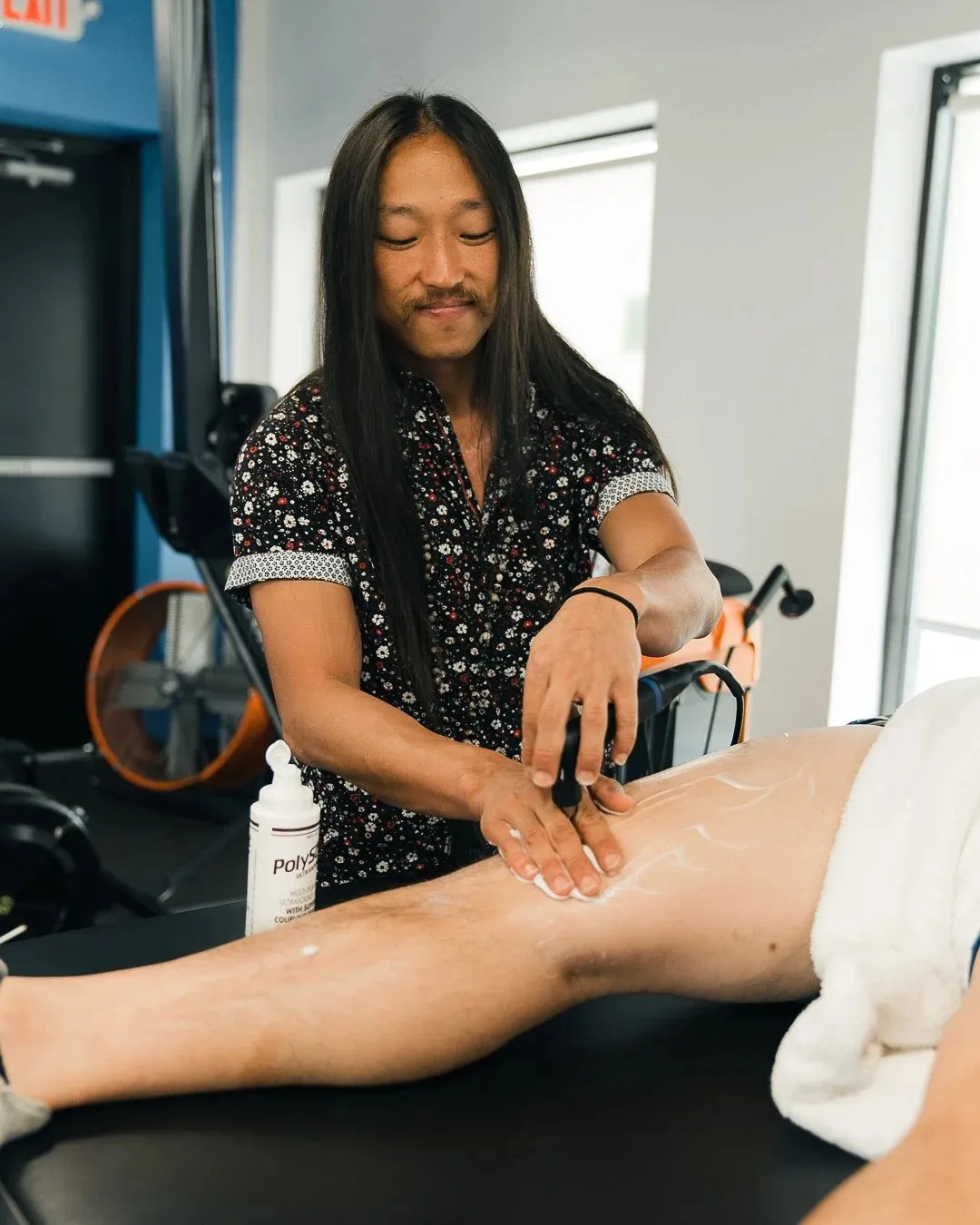 Dr. Gershom Kim, DPT, working with a patient