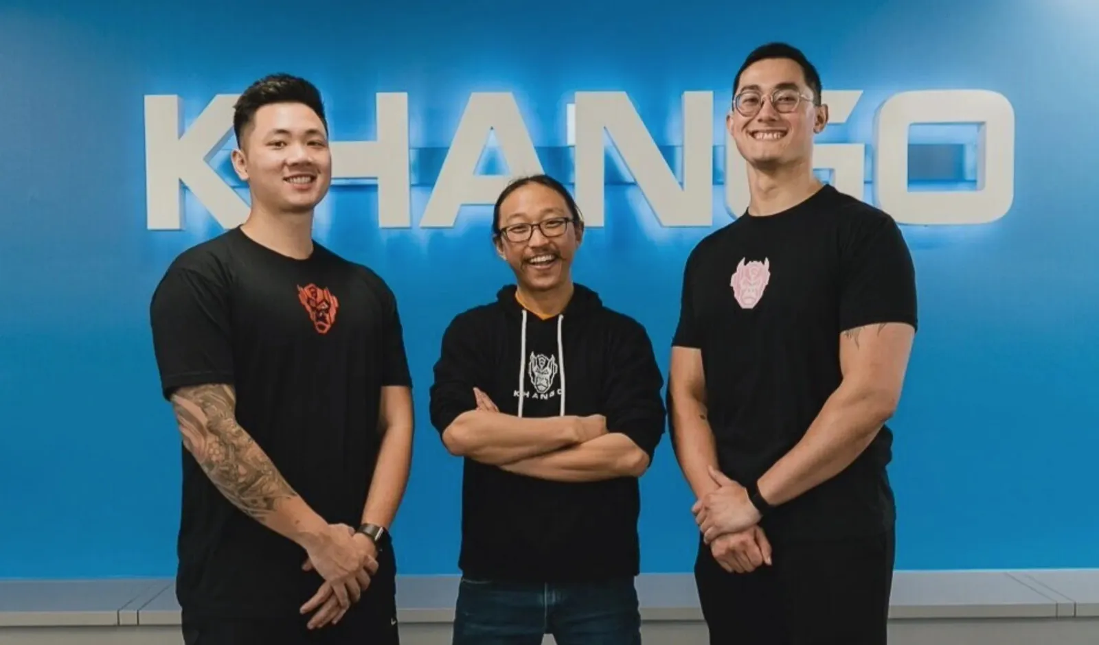 Dr. Kim with the Khango Gym team in front of the Khango sign